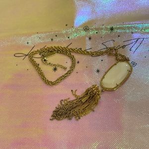 Kendra Scott.  White mother of pearl stone  Gold chain with tassel